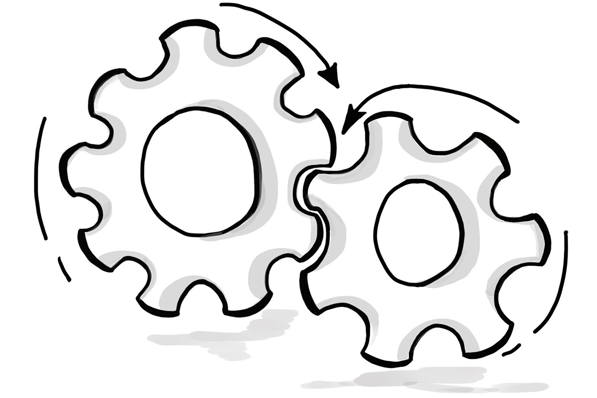 Zwei ineinandergreifende Zahnräder als Symbol für Zusammenarbeit